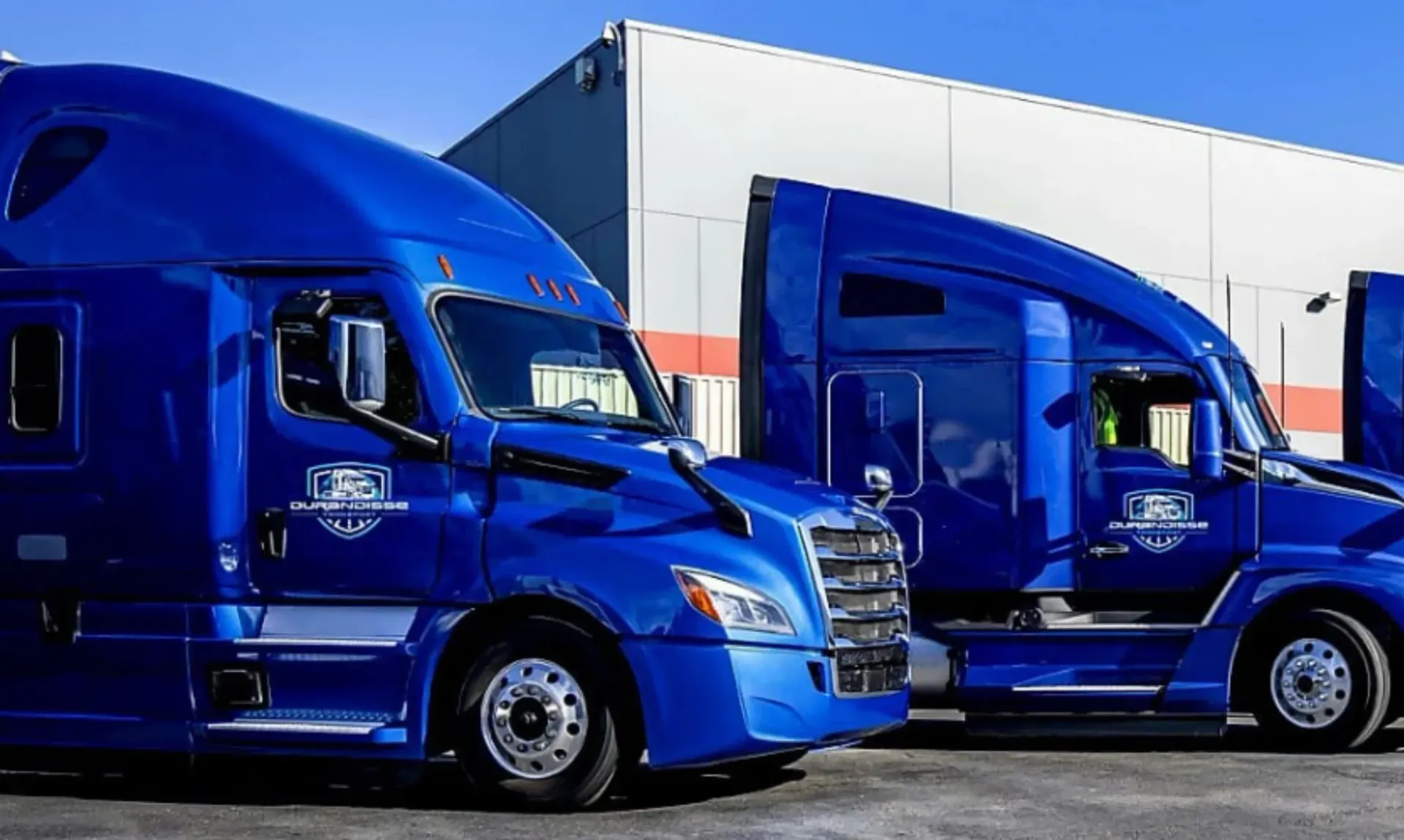 Blue Durandisse fleet trucks outside a warehouse